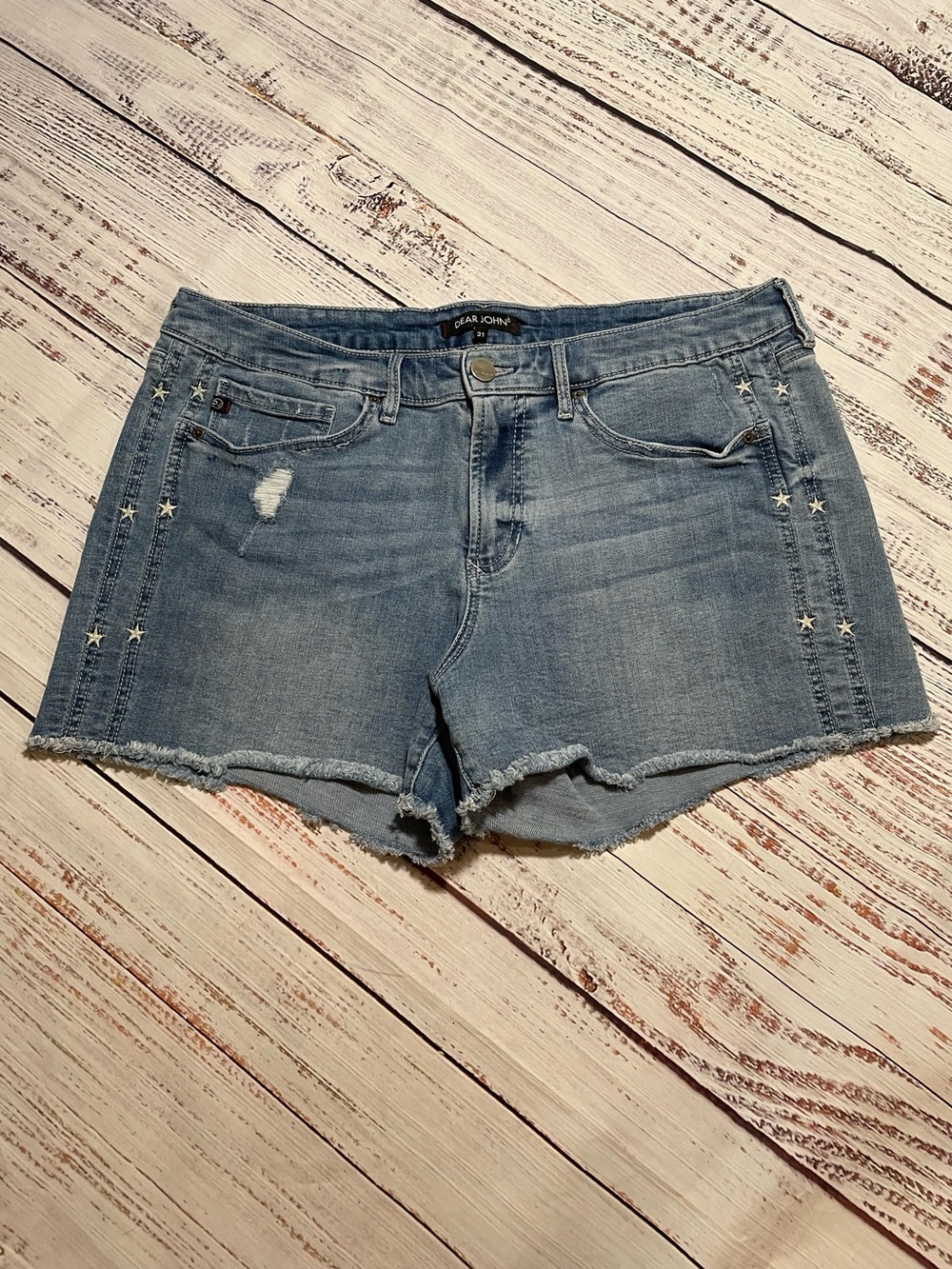 Dear John denim shorts featuring stars running down side. Size 31.